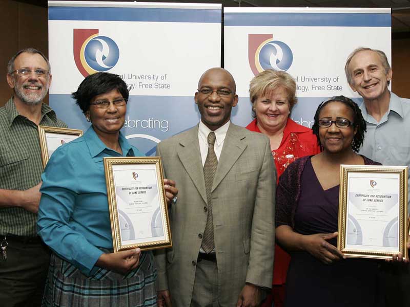 Staff members honoured for their huge contribution by Professor Thandwa Mthembu at Long Service Awards.